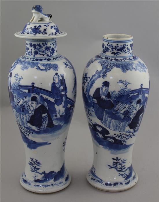 Two Chinese blue and white baluster vases and a cover, late 19th century, 28cm